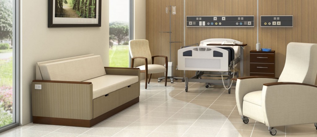 Kwalu's healthcare furniture is ideally suited to hospital patient room settings. This image features Kwalu's flip-down Carrara double sleeper loveseat, the Valentia wall-saver patient chair, the Valentia motorized recliner with optional heating and massage, Kwalu's Hollywood casegoods bedside cabinet and Kwalu's repairable wall protection as a headwall.