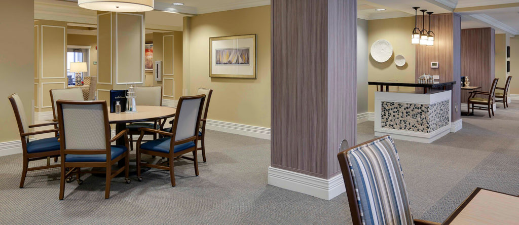 Examples of dining room and lounge area furniture, custom-designed to meet the needs of assisted living environments.