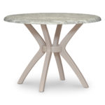 Durable muted color round dining table.