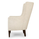White high back lounge chair with buttons.