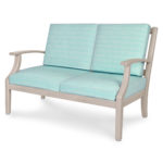 Teal and gray cushioned loveseat.
